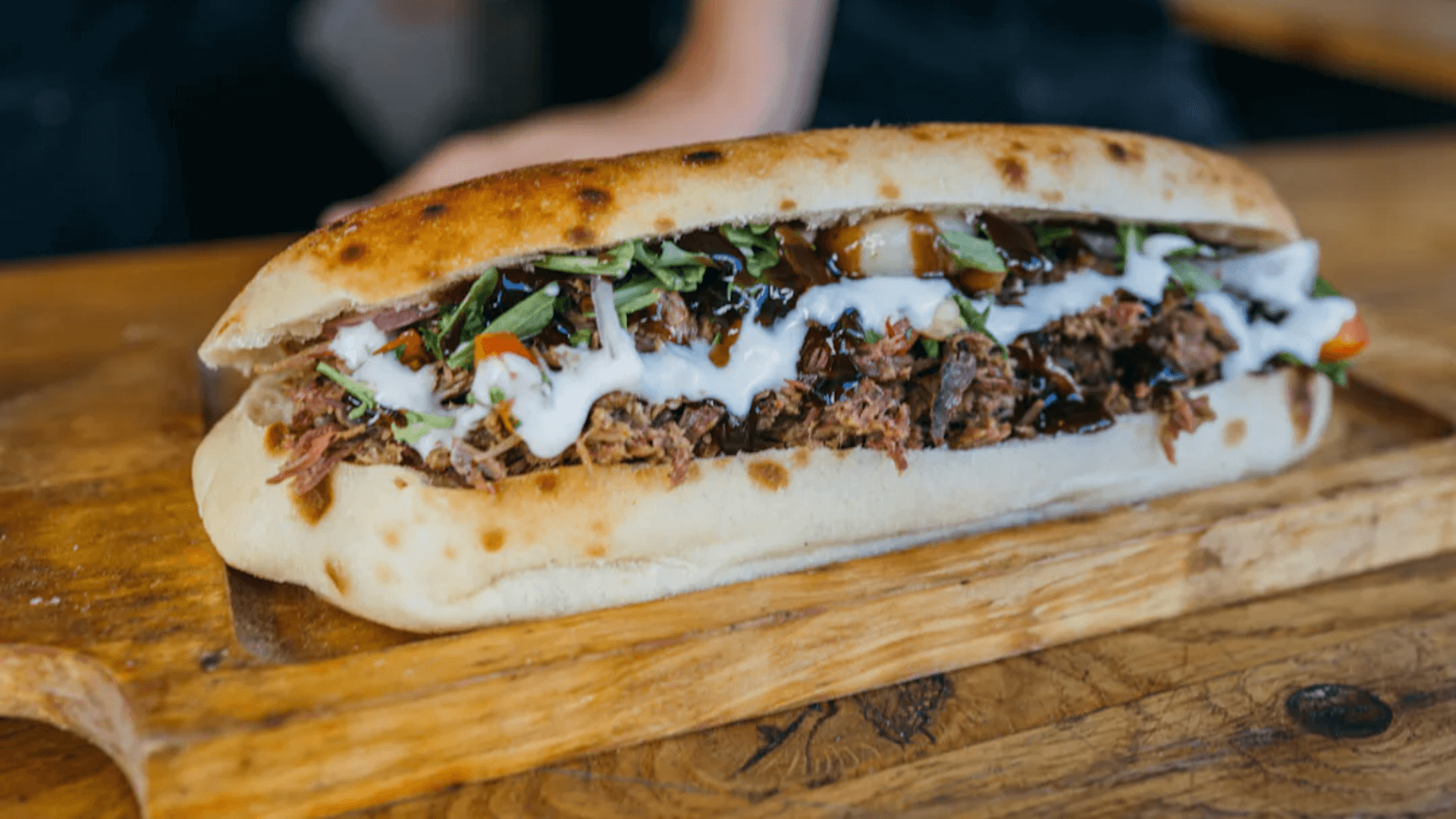 meat sandwich on a wooden table